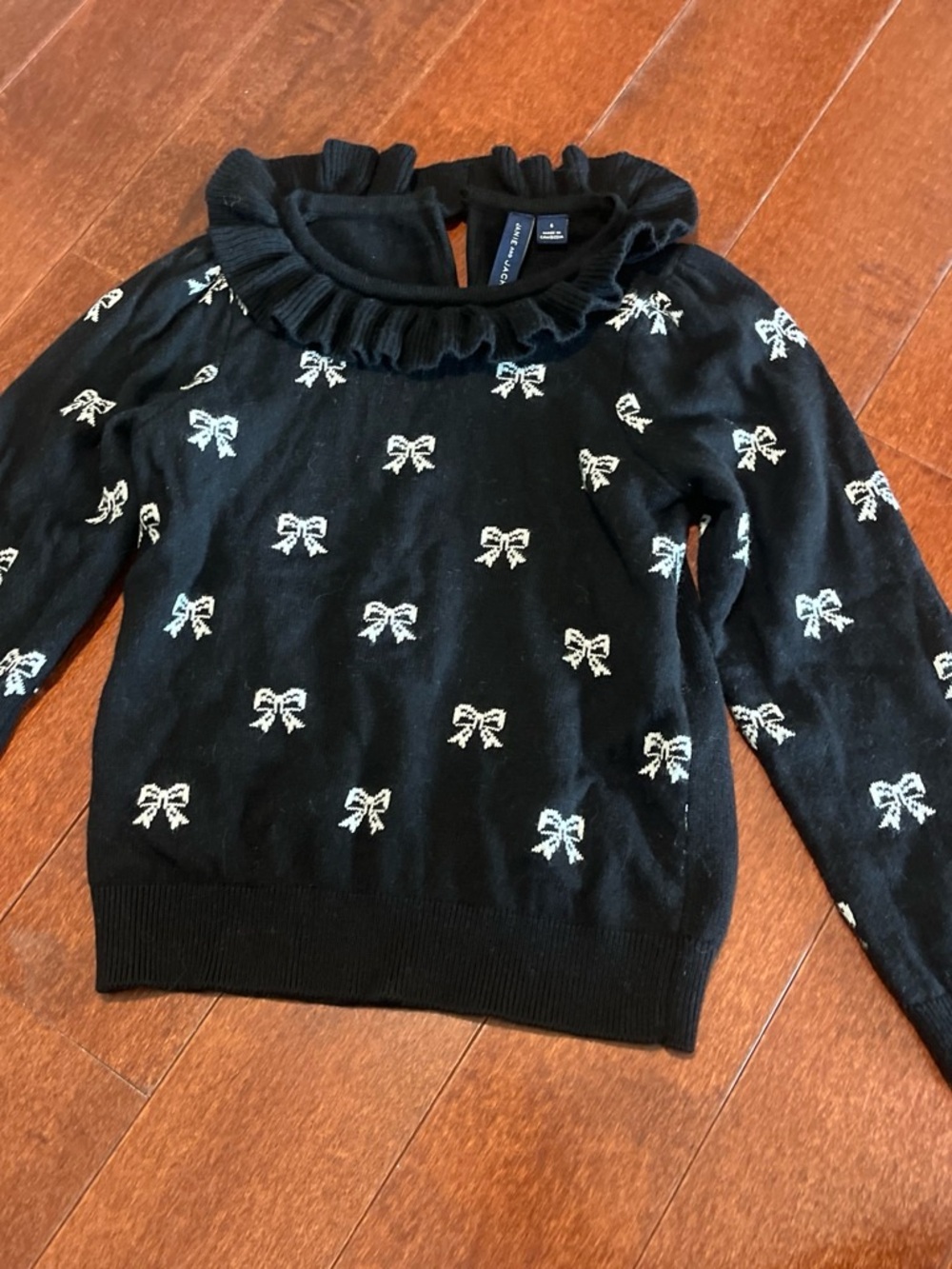 Janie and Jack Black Sweater with White Bow Motif
